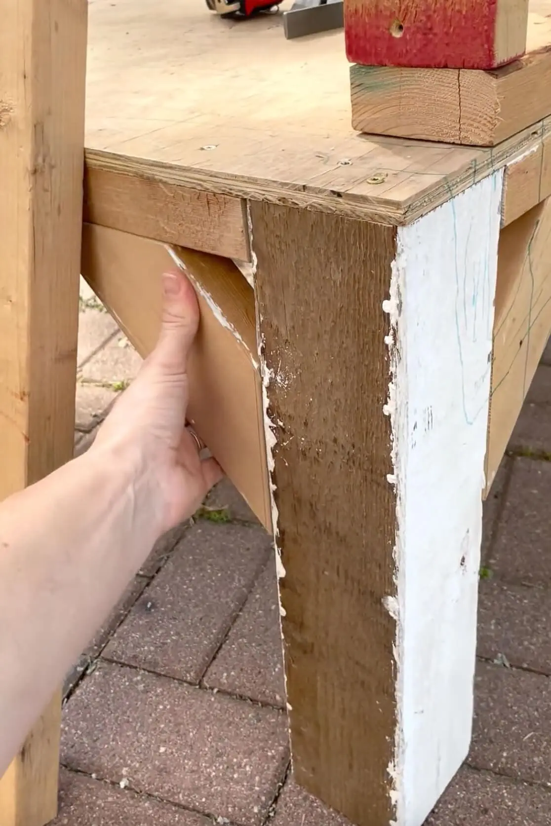 Adding bracing to our backyard DIY chicken coop.